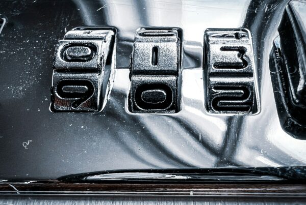 a close up of a metal plate with numbers on it